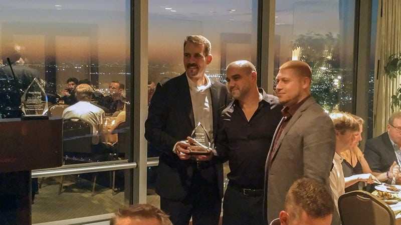 Point of Rental CEO Wayne Harris presents Pedersen's with an Innovation Award on Tuesday, Oct. 11.