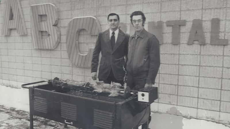 Joe Kellner and part of the early sales team at ABC Rentals enjoy grilling some meat in 1975.