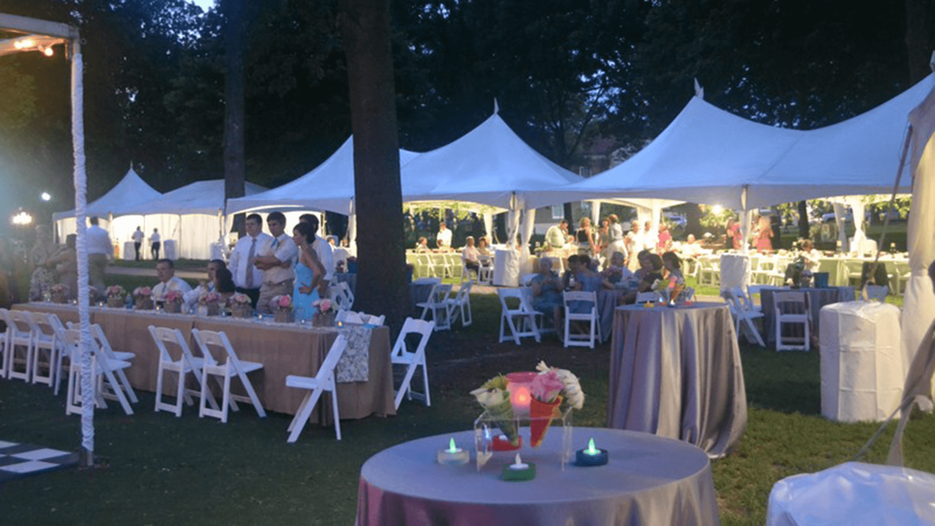 Busylad Rent-All provides tents and event decor for events like this outdoor wedding.