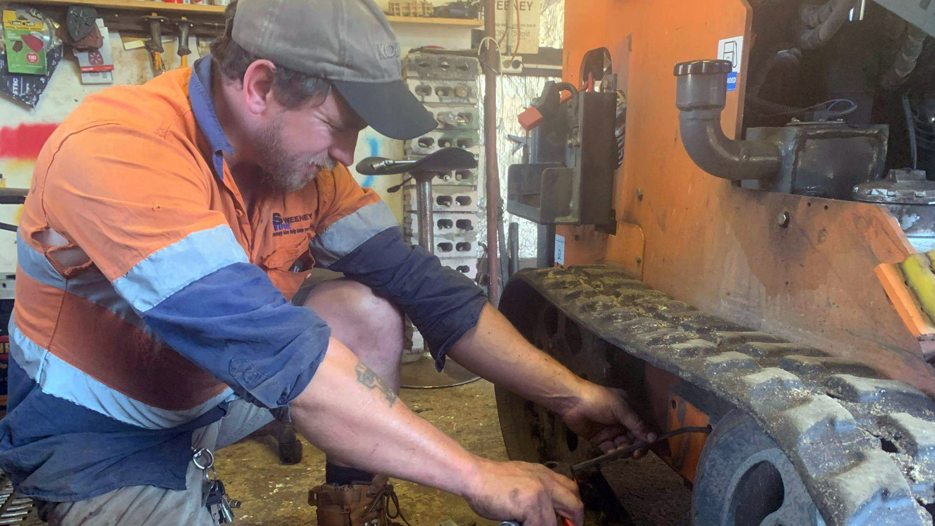 Co-owner Tom Sweeney works on equipment at Sweeney Hire.