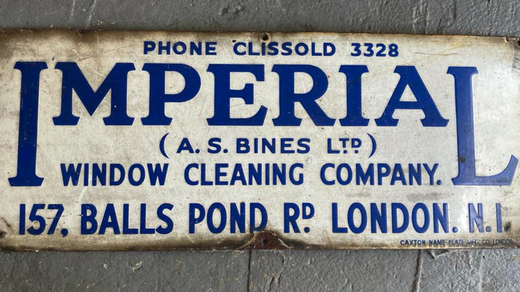 A sign for North London Plant Hire's original window-cleaning business