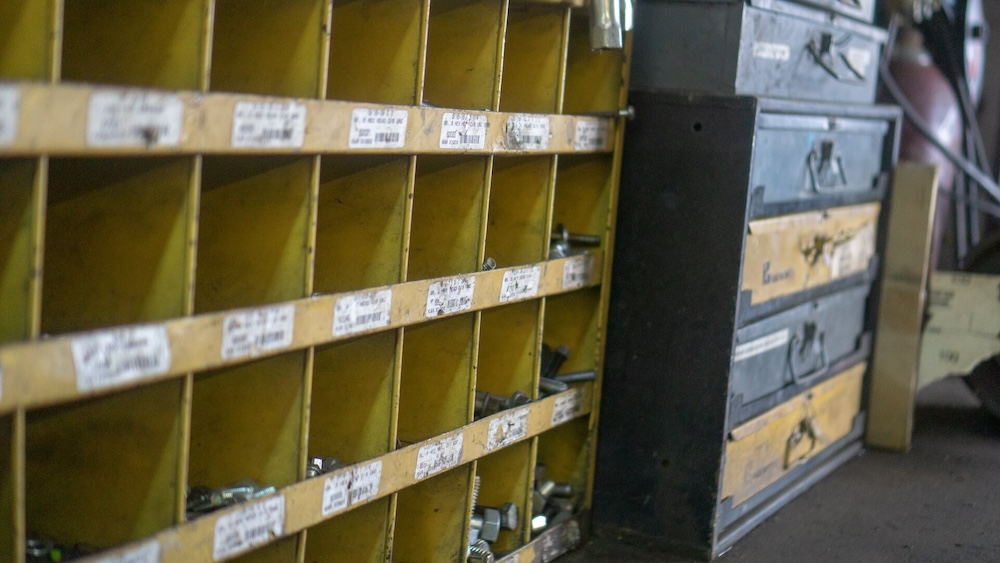 Neatly organized parts shelves with bar codes associated on every bin label.