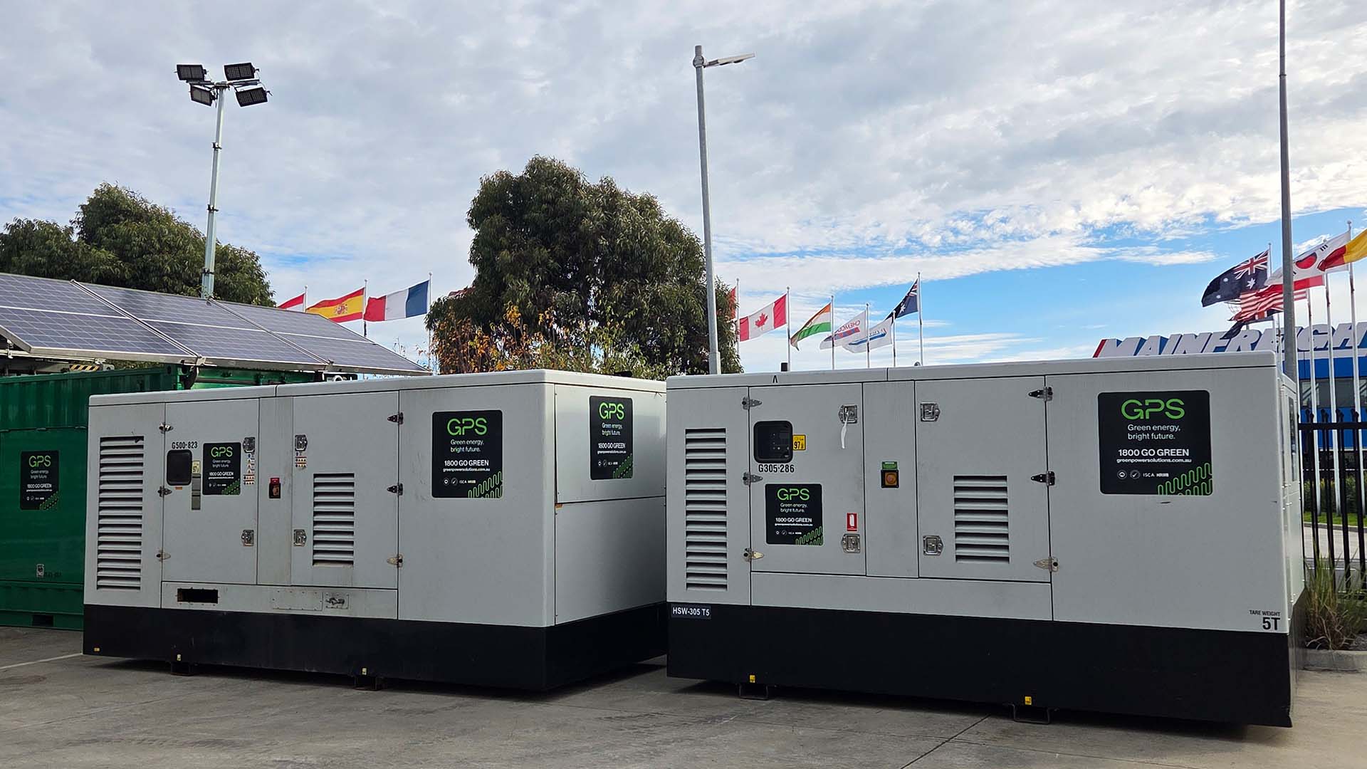 Two large GPS generators on a lot.